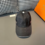 Baseball cap, dark textured fabric, white top button, curved brim