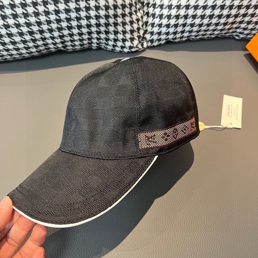 Baseball cap, dark textured fabric, wide patterned band at front