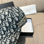 Dior cap close-up of black-and-white Dior monogram fabric, curved brim