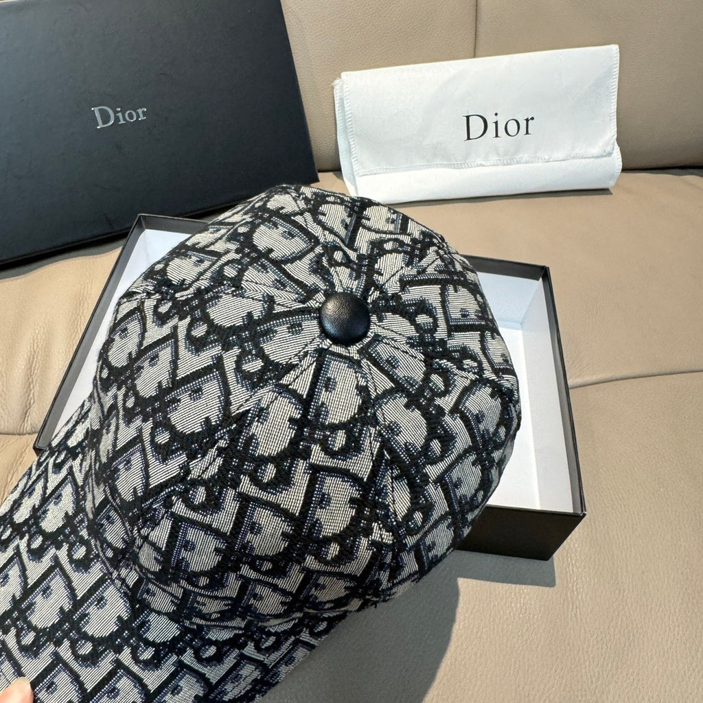 Dior cap with black-and-white monogram fabric and rounded crown with button
