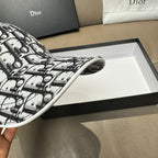 Dior cap side view showing curved brim edge in black-and-white monogram print
