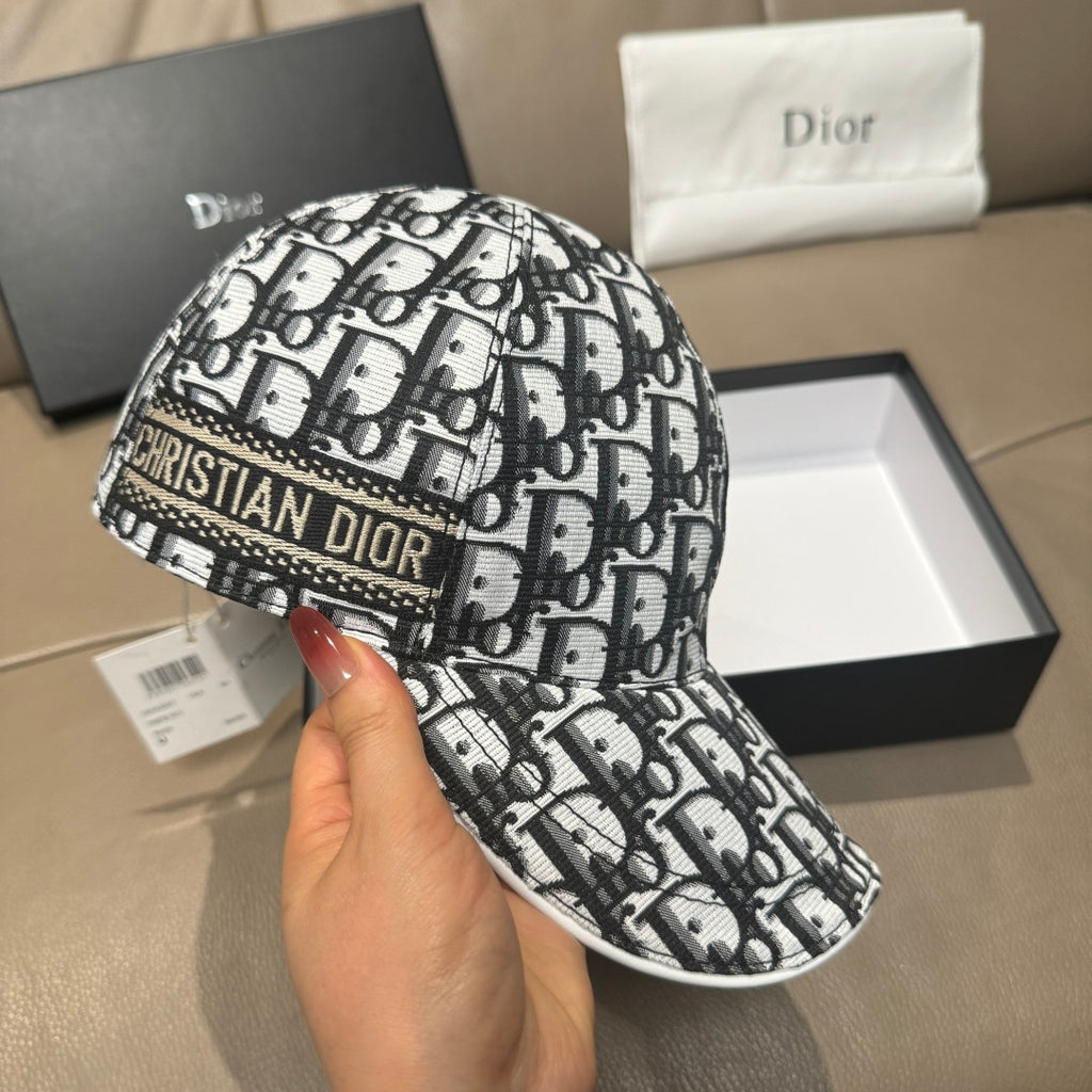 Dior cap in black-and-white monogram pattern with curved brim and stitching