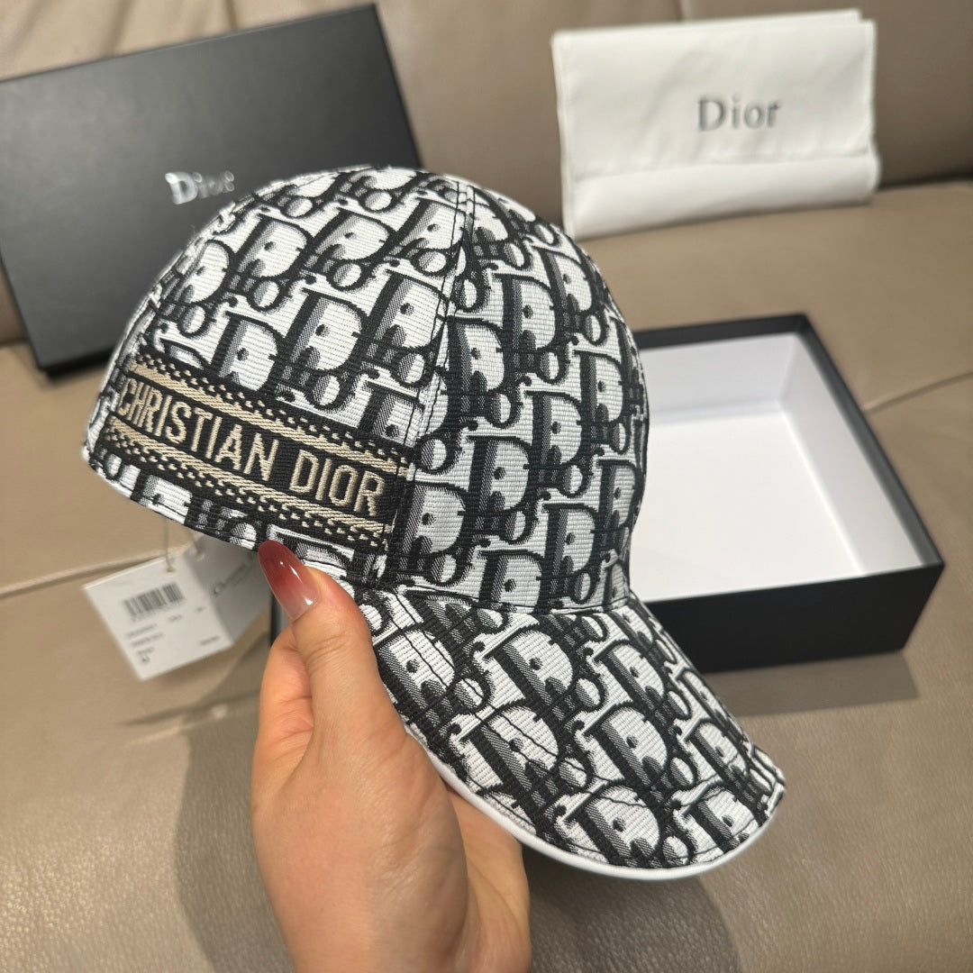 Dior cap in black-and-white monogram pattern with curved brim and stitching