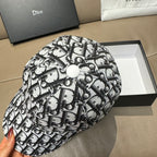Dior cap with black-and-white monogram print and fabric button on top
