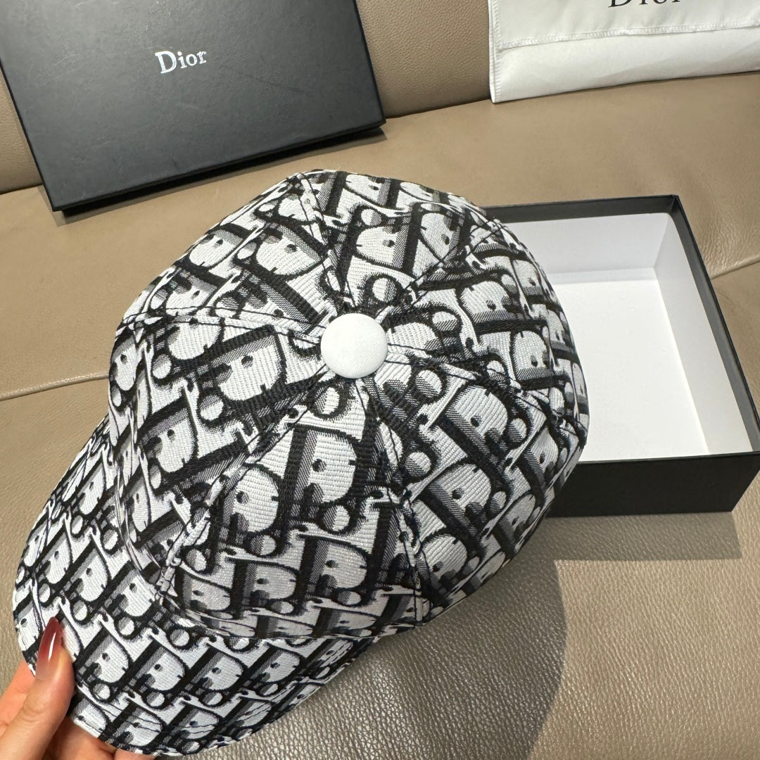 Dior cap with black-and-white monogram print and fabric button on top