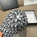 Dior baseball cap top view, black-and-white Dior logo pattern, round top button.