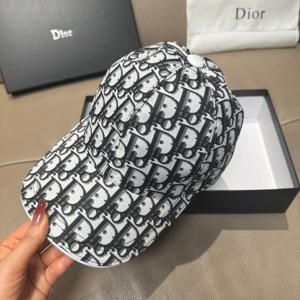 Dior baseball cap side view, black-and-white Dior pattern, curved brim.