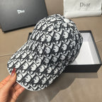 Dior baseball cap side view, black-and-white Dior pattern, curved brim.
