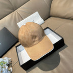 Beige monogram baseball cap with curved brim and stitched panels