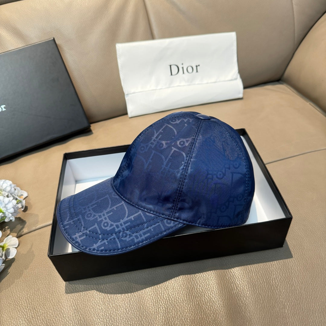Blue monogram baseball cap on box, curved brim and embroidered-style pattern