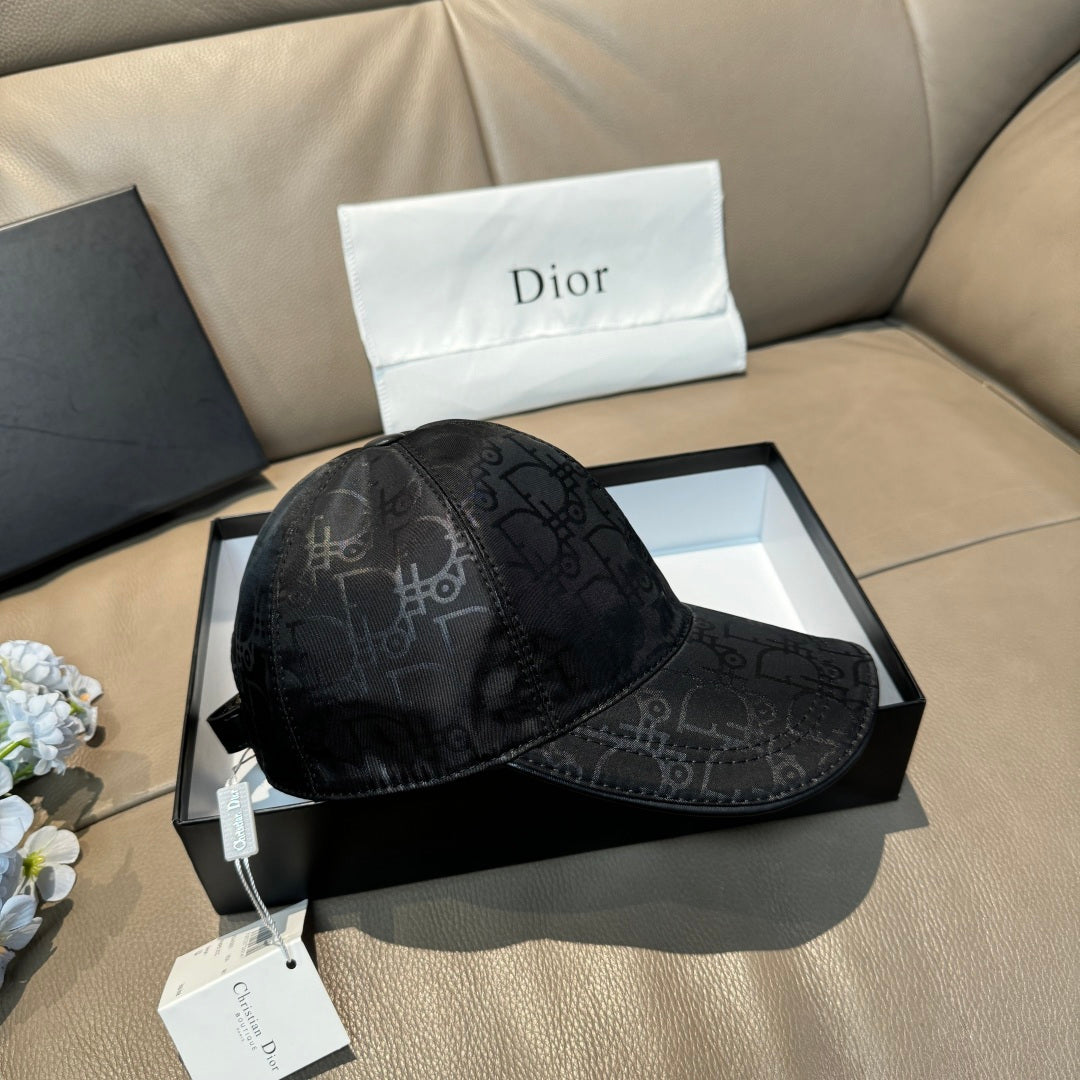 Dior baseball cap in dark monogram-print fabric shown from side with curved brim