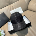Dior baseball cap in dark monogram-print fabric with curved brim and stitched crown seams