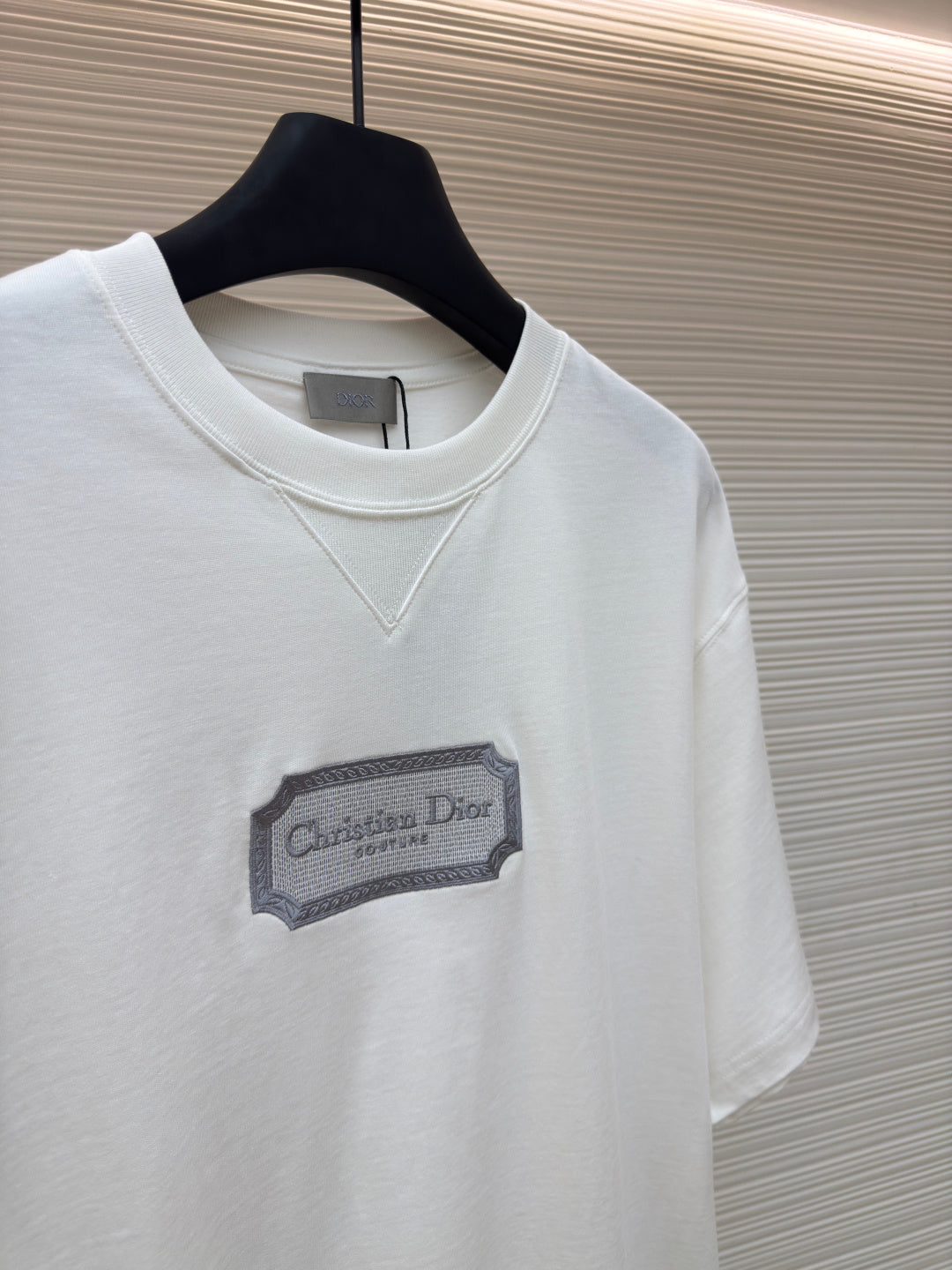 White short-sleeve T-shirt with V-stitch neckline and Christian Dior logo patch