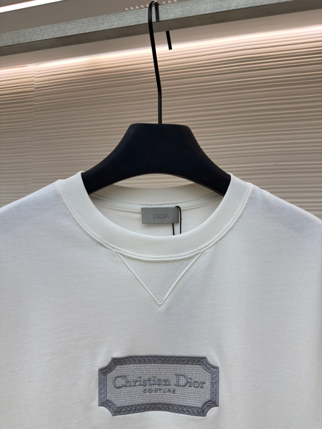 White short-sleeve T-shirt with V-stitch neckline and Christian Dior logo label