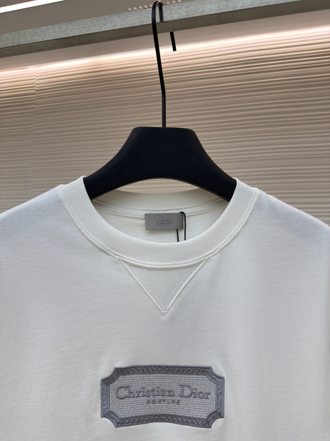 White short-sleeve T-shirt with V-stitch neckline and Christian Dior logo label