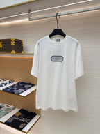 White short-sleeve T-shirt with Christian Dior logo patch at chest