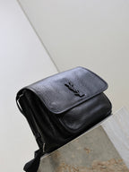 Black textured-leather crossbody bag angled view with front flap and strap