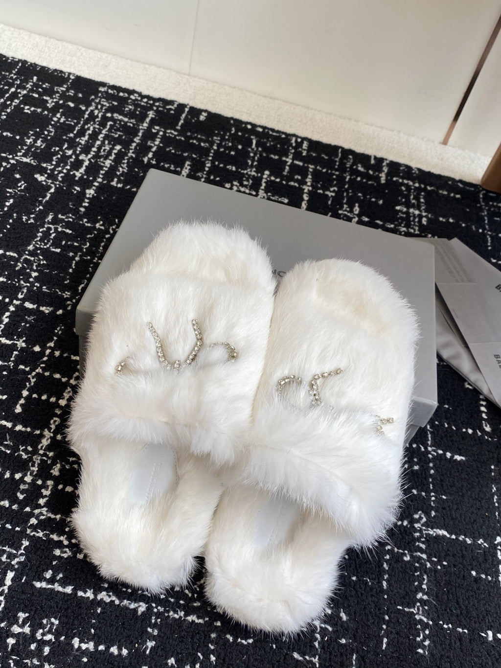 Balenciaga white faux-fur slide sandals with silver-tone bow logo charm