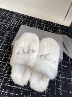Balenciaga white faux-fur slide sandals with silver-tone bow logo charm