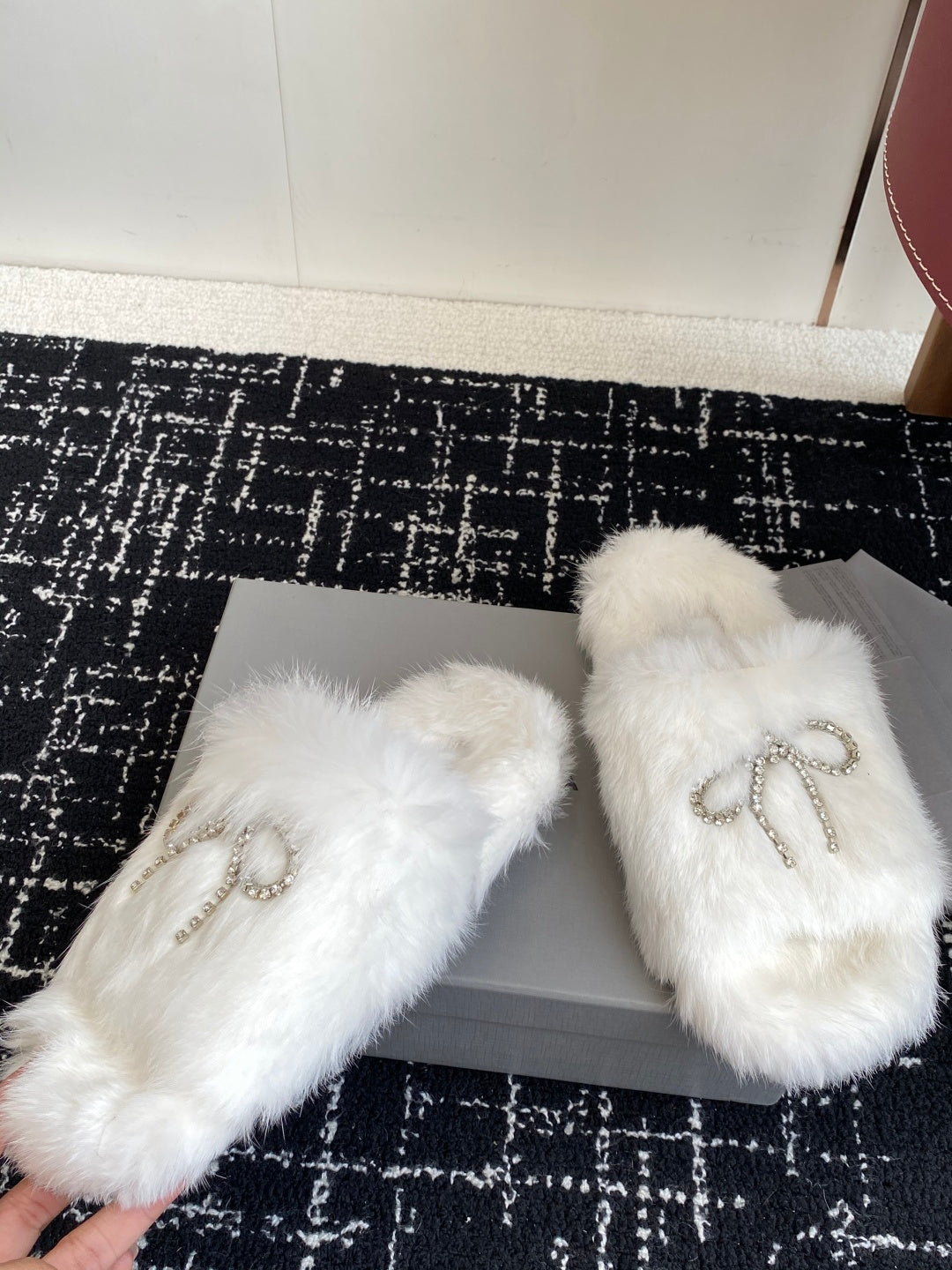 Balenciaga white faux-fur slide sandals with silver-tone logo bow on straps
