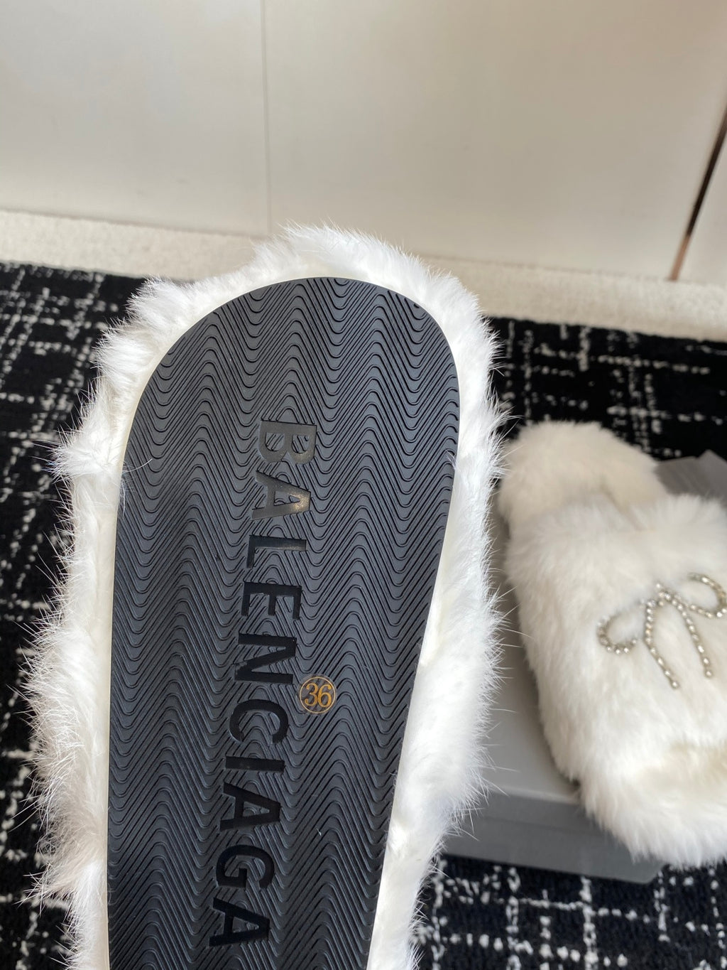 Balenciaga white faux-fur slide sandal sole with gray Balenciaga lettering