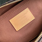 Designer monogram handbag interior fabric label with stitched border