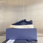Unisex sneakers dark blue suede with light blue laces and embroidered text on side