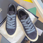 Unisex sneakers pair, dark blue suede with light blue laces and white midsoles