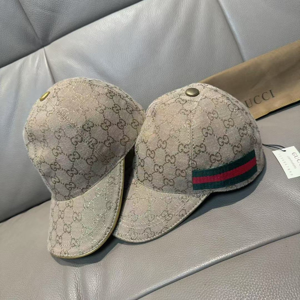 Two Gucci beige GG canvas caps with green-red-blue stripes on fronts