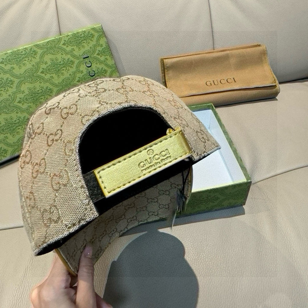 Gucci beige GG cap with black sweatband and yellow GUCCI logo patch