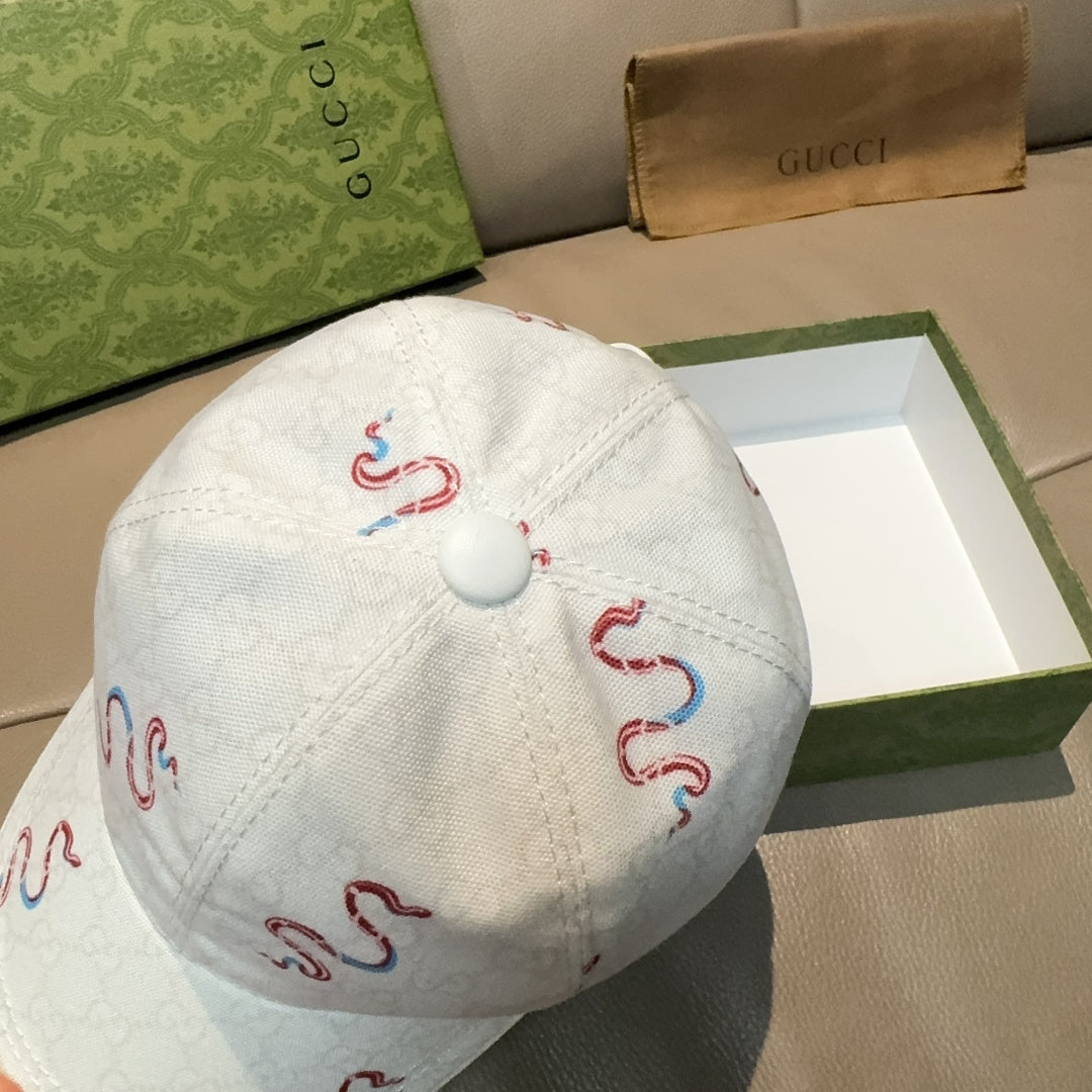 Gucci white canvas cap with red and blue snake embroidery, metal button back