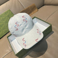 Gucci white canvas cap with red and blue snake embroidery, curved brim