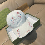 Gucci white canvas cap with red and blue snake embroidery, curved brim