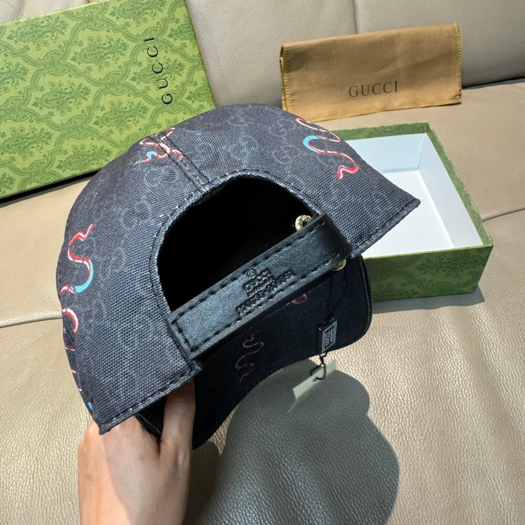 Gucci baseball cap side view with dark denim strap and embroidered red/blue motif