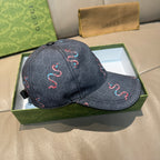 Gucci baseball cap, dark denim with embroidered red and blue snake motifs