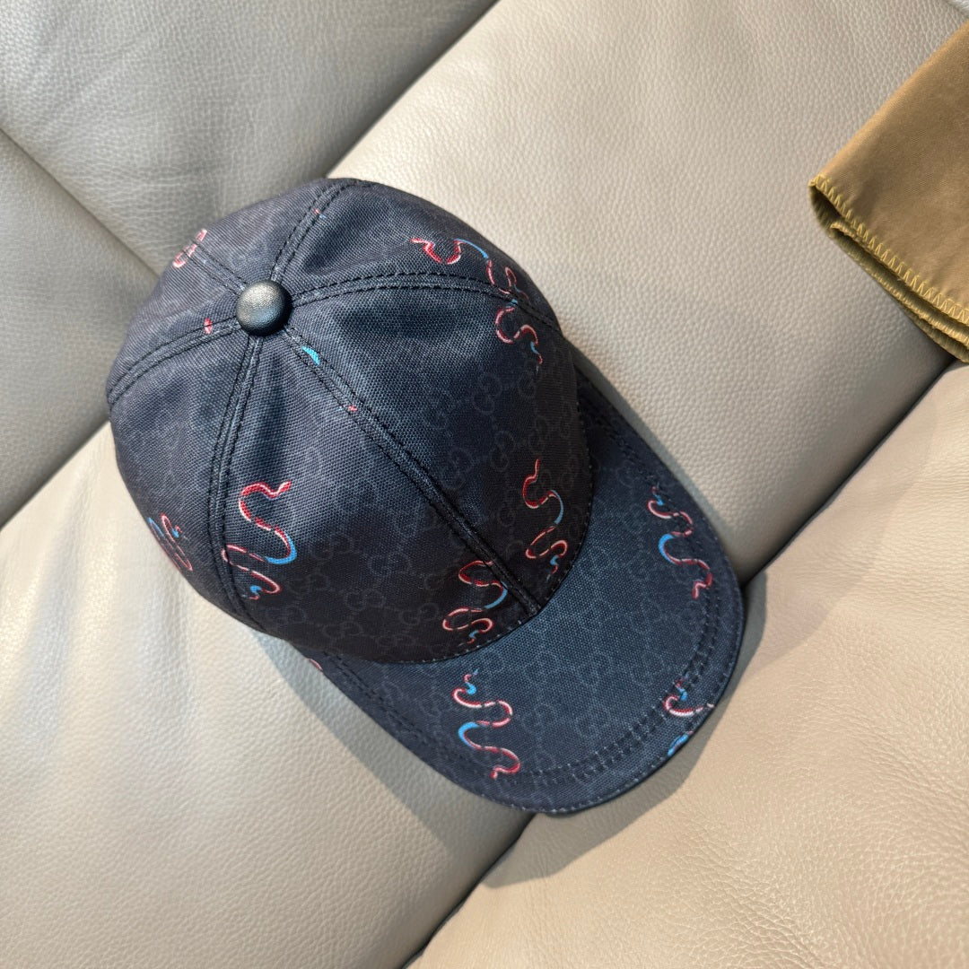 Gucci baseball cap, dark denim with embroidered red and blue swirls