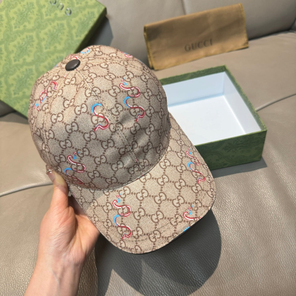 Beige Gucci baseball cap, front three-quarter view with multicolor snake print