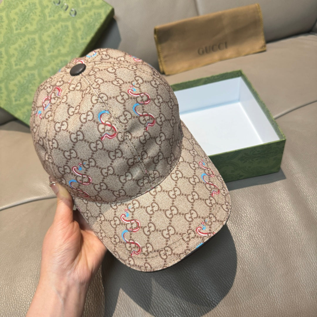 Beige Gucci baseball cap, front three-quarter view with multicolor snake print