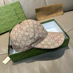 Beige Gucci baseball cap with multicolor snake pattern; view of side panels and brim