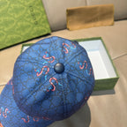Gucci blue cap crown view with button top and GG monogram pattern