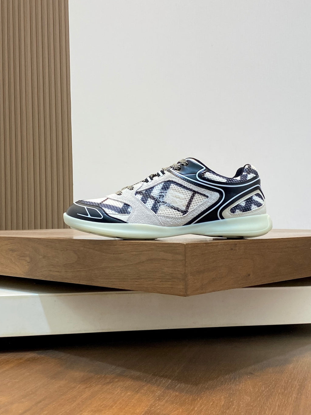 Burberry lace-up sneakers with blue graphic panels, white upper, and light mint sole