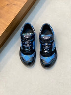 Blue and black athletic sneakers with lace-up front and sporty side logo detail