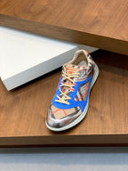 Single blue multicolor lace-up sneaker with patterned upper and contrast edging
