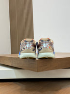 Back view of blue multicolor sneakers on a display platform