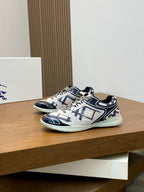 Burberry low-top sneakers with navy-and-white geometric pattern and mint-colored outsole