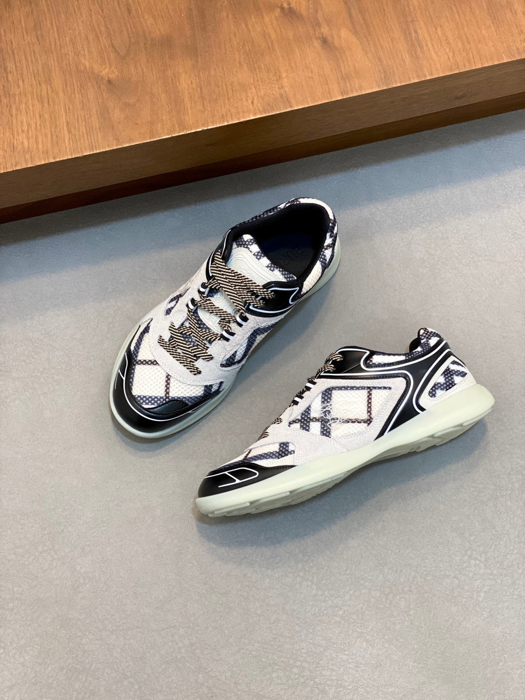 Burberry patterned sneakers with white upper, navy trim, and mint sole for everyday wear