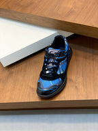 Blue and black athletic sneaker on shelf with lace-up front and cushioned sole
