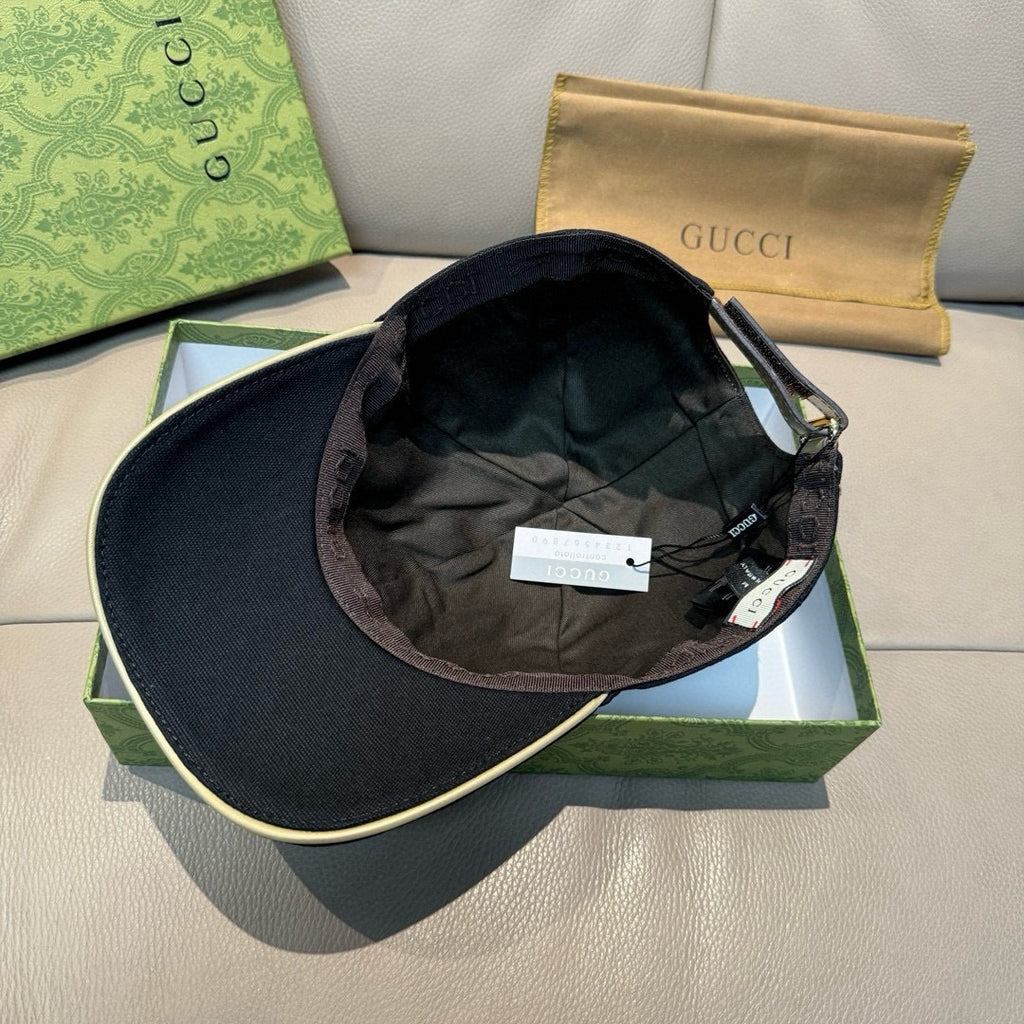 Gucci cap interior and brim with black lining and hanging tags