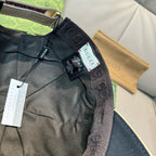 Gucci cap interior view with tags and black fabric lining near the strap