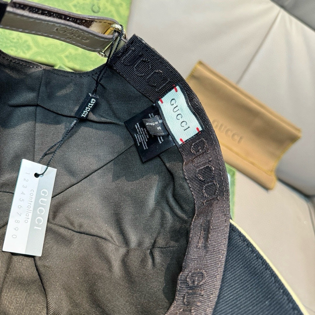 Gucci cap interior view with tags and black fabric lining near the strap